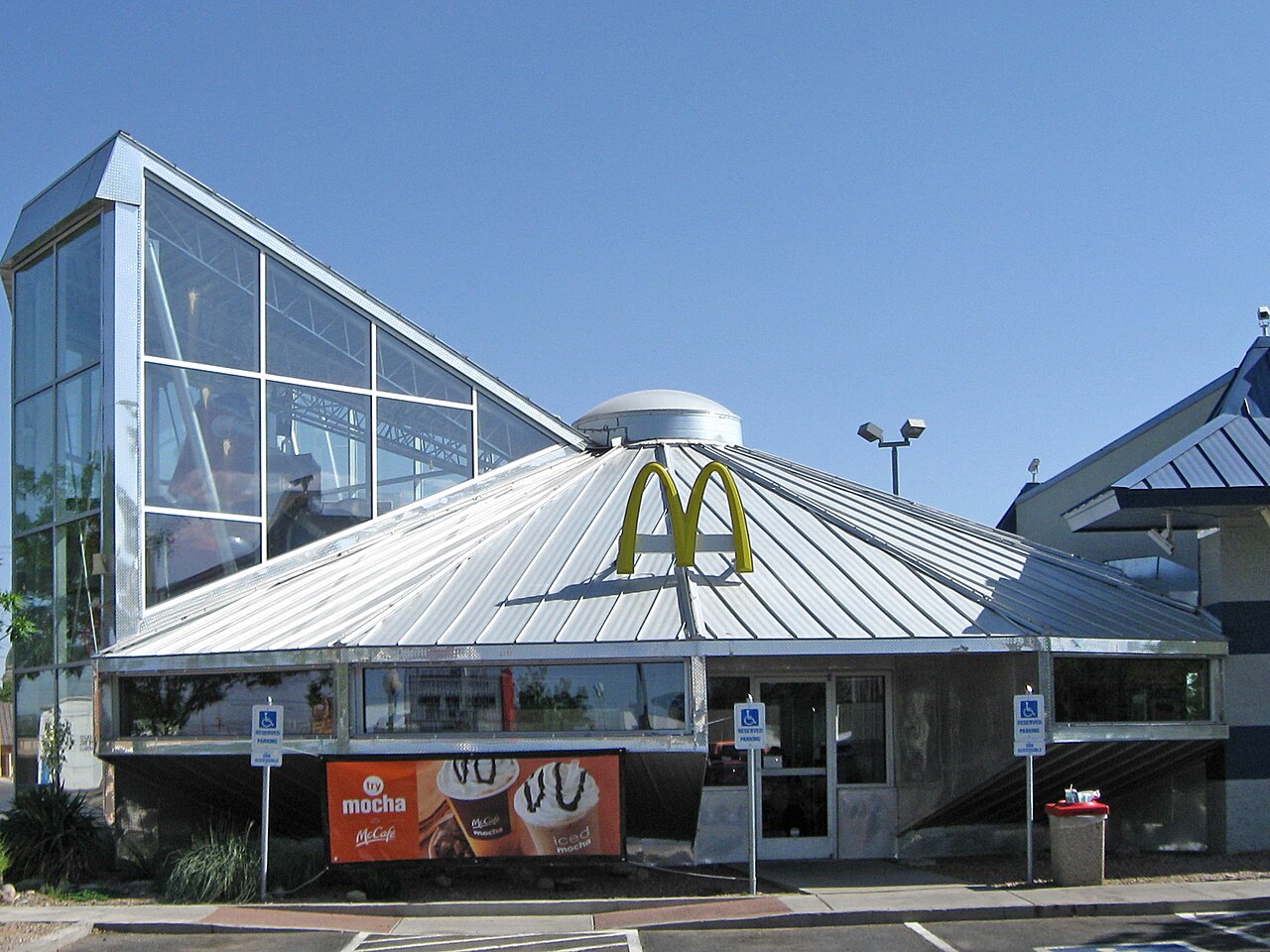 A McDonald's restaurant built as a metal flying saucer, with the golden arches on the domed roof