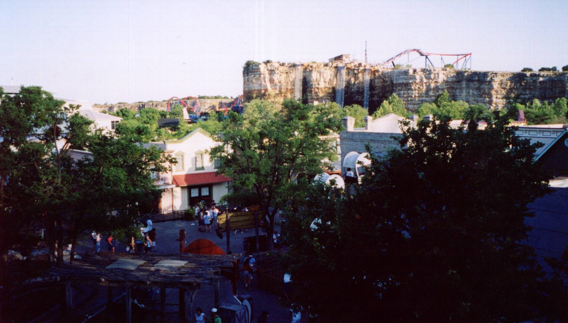 Roller coaster running along limestone quarry cliffs at Six Flags Fiesta Texas